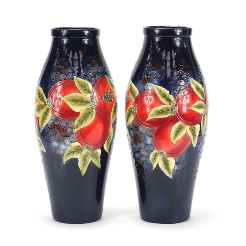 510 - Large pair of William Moorcroft style vases hand painted with fruit, each 40.5cm high