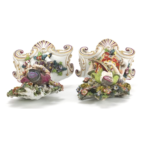 867 - Pair of Chelsea style porcelain figures with dogs and floral encrusted backs, each approximately 21c... 