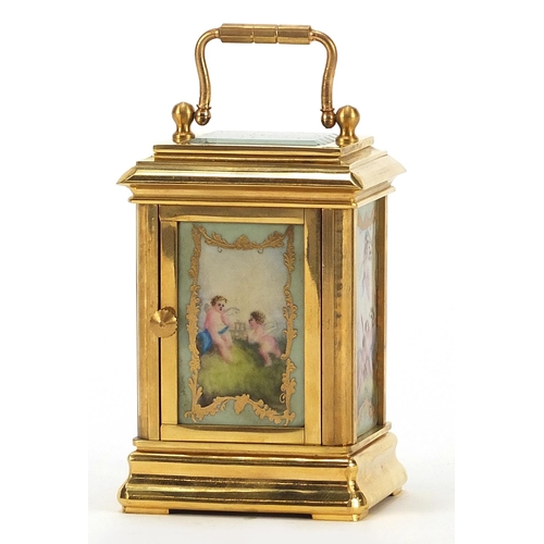 244 - French style gilt metal perpetual carriage clock with Sevres style panels, 8cm high