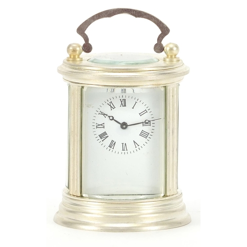 245 - Circular silver plated carriage clock with Roman numerals, 7cm high