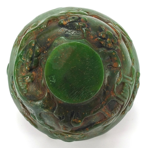 831 - Chinese green jade bowl carved with cranes in a landscape amongst prunus blossom, 13cm in diameter