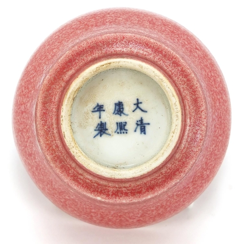 827 - Chinese porcelain bowl having a pink glaze, six figure character marks to the underside, 9.5cm in di... 