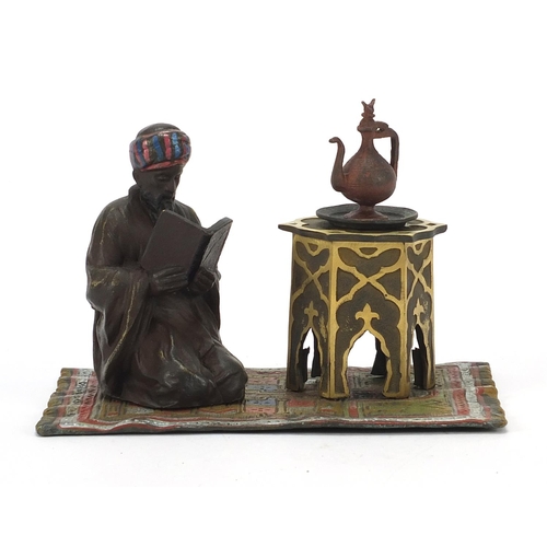 793 - Cold painted bronze figure of an Arab on carpet in the style of Franz Xaver Bergmann, 14cm wide