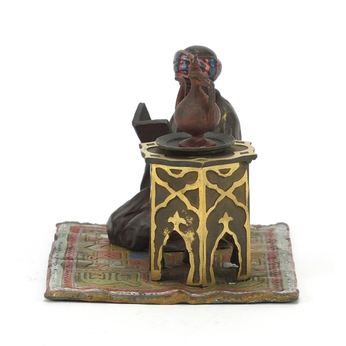 793 - Cold painted bronze figure of an Arab on carpet in the style of Franz Xaver Bergmann, 14cm wide