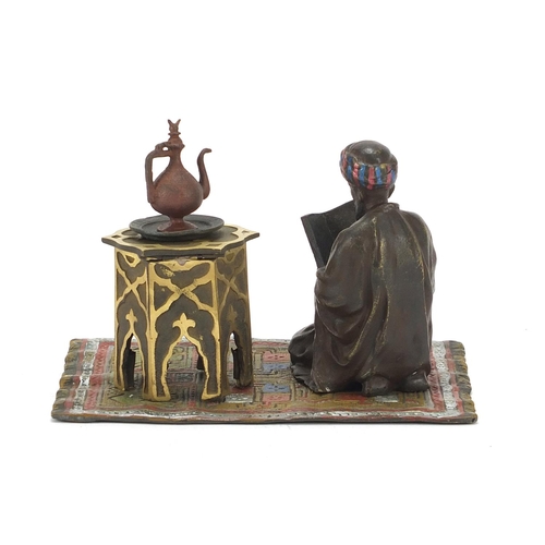 793 - Cold painted bronze figure of an Arab on carpet in the style of Franz Xaver Bergmann, 14cm wide