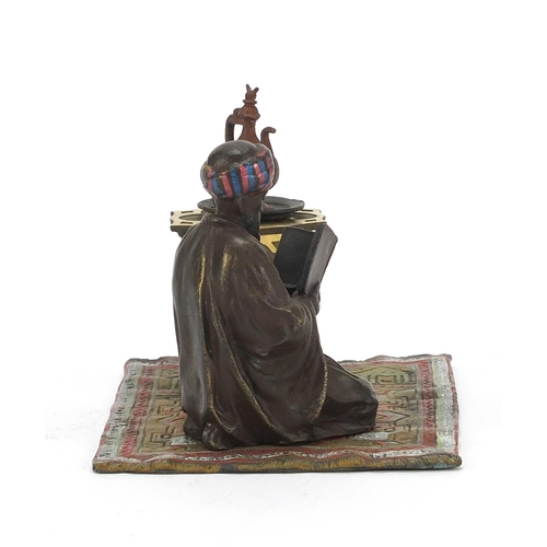 793 - Cold painted bronze figure of an Arab on carpet in the style of Franz Xaver Bergmann, 14cm wide