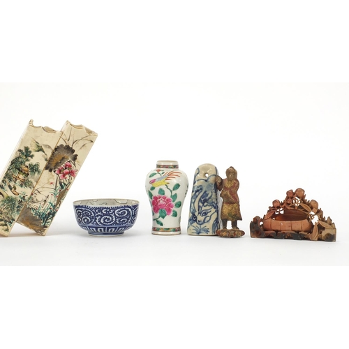 928 - Chinese and Japanese ceramics including a cup and saucer hand painted in the famille rose palette an... 