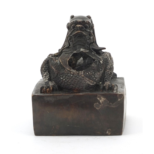 472 - Very large Chinese patinated bronze dragon seal, character marks to the underside, 16cm high