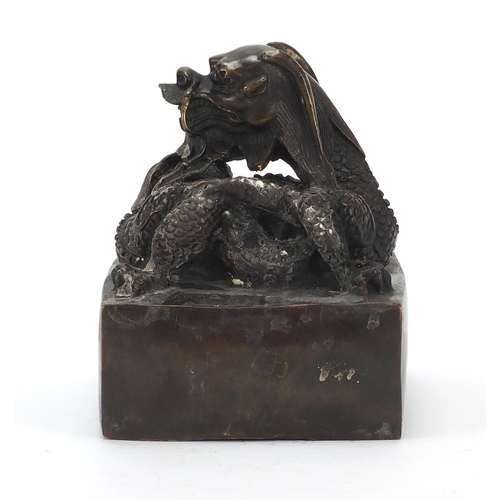 472 - Very large Chinese patinated bronze dragon seal, character marks to the underside, 16cm high