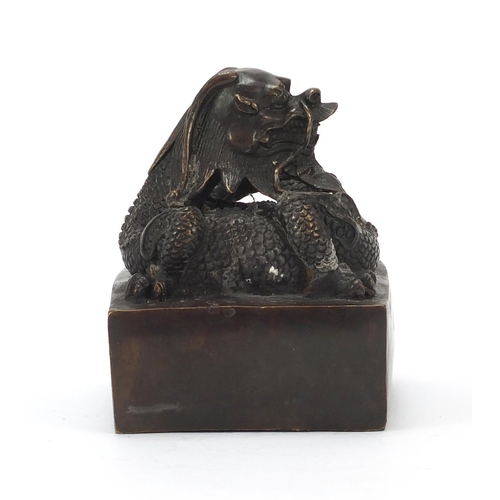 472 - Very large Chinese patinated bronze dragon seal, character marks to the underside, 16cm high