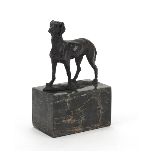 1042 - Patinated bronze greyhound raised on a rectangular block marble base, 19cm high