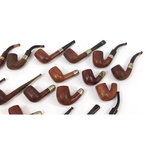 233 - Collection of vintage smoking pipes mostly with silver plated or gold coloured metal collars includi... 