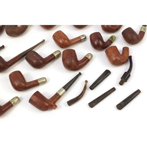 233 - Collection of vintage smoking pipes mostly with silver plated or gold coloured metal collars includi... 