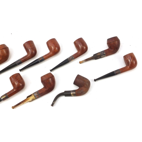 232 - Twelve vintage silver mounted smoking pipes, mostly impressed Antidote