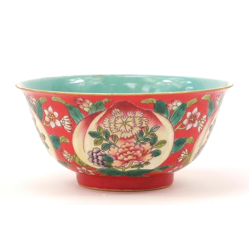 929 - Chinese porcelain red ground bowl hand painted with peaches and flowers, four figure character marks... 