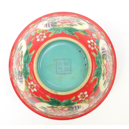 929 - Chinese porcelain red ground bowl hand painted with peaches and flowers, four figure character marks... 