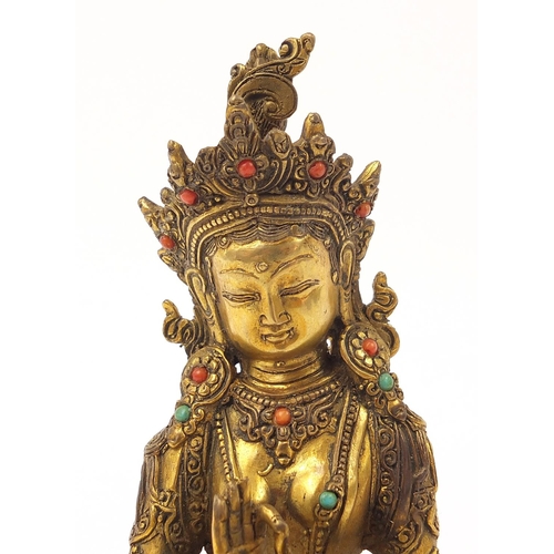 936 - Chino Tibetan patinated bronze jewelled Buddha, 22cm high