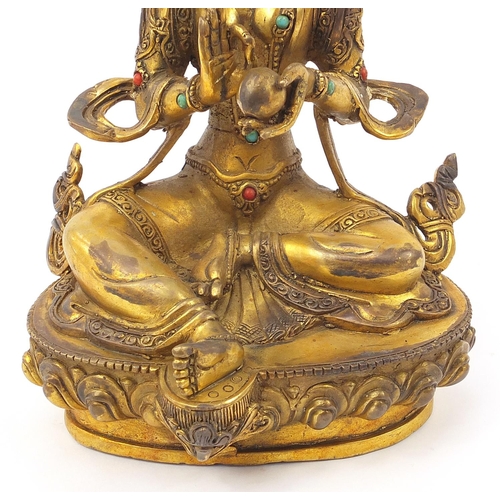 936 - Chino Tibetan patinated bronze jewelled Buddha, 22cm high