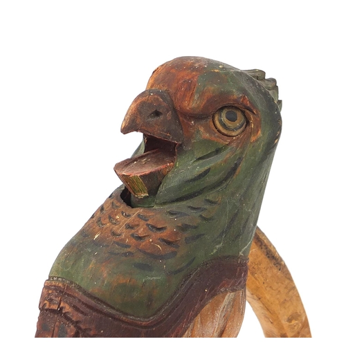 141 - Pair Black Forest carved wood nutcrackers in the form of a parrot, 18.5cm high