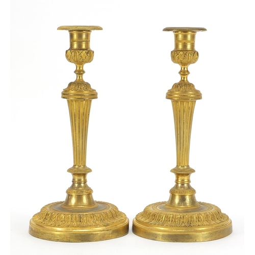 29 - Pair of Antique French Louis XVI style ormolu candlesticks, each 28cm high