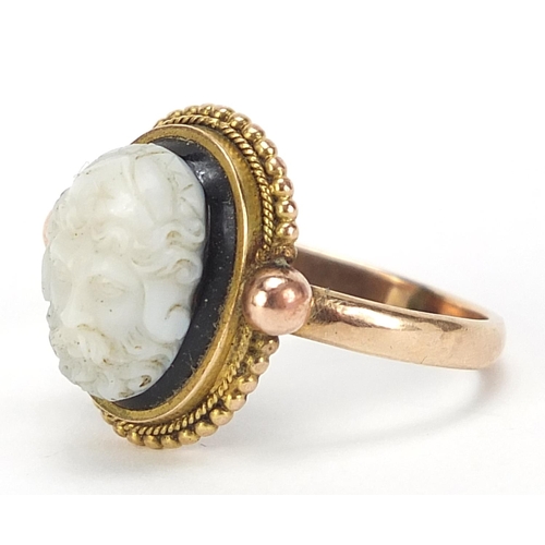 121 - Antique unmarked gold and glass ring, depicting a bust of a mythical figure, size R, 5.2g