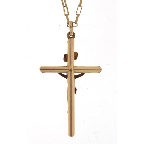 699 - 9ct gold crucifix pendant on 9ct gold necklace, 5cm high and 60cm in length, total 7.8g