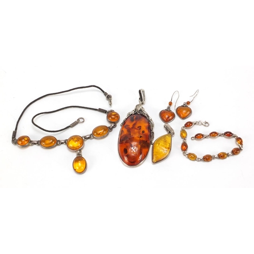 666 - Silver and natural amber jewellery comprising large pendant, necklace, bracelet, earrings and one ot... 