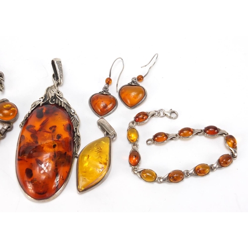 666 - Silver and natural amber jewellery comprising large pendant, necklace, bracelet, earrings and one ot... 