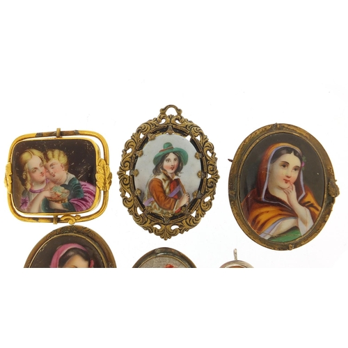 498 - Five antique porcelain portrait miniature brooches with gilt metal mounts and a silver cameo pendant... 