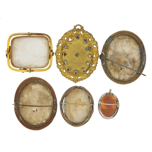 498 - Five antique porcelain portrait miniature brooches with gilt metal mounts and a silver cameo pendant... 