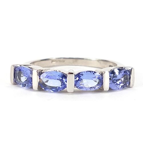 854 - 9ct white gold purple stone ring, possibly tanzanite, size N, 3.4g