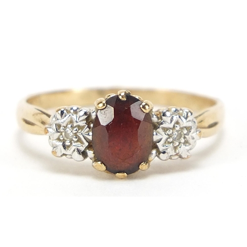 581 - 9ct gold diamond and garnet three stone ring, size U, 2.7g