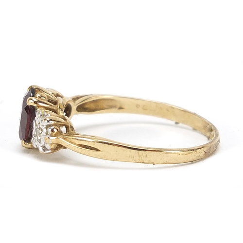 581 - 9ct gold diamond and garnet three stone ring, size U, 2.7g