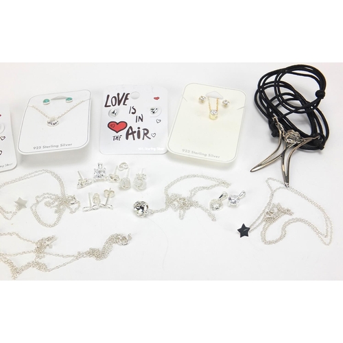 658 - Silver jewellery including three cabochon stone brooches, earrings, necklaces and a monkey pendant w... 