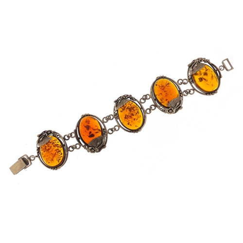 918 - Large naturalistic silver and amber bracelet, 20cm in length, 52.8g