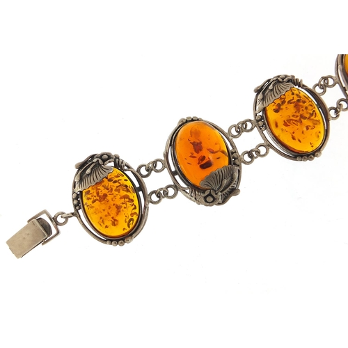 918 - Large naturalistic silver and amber bracelet, 20cm in length, 52.8g