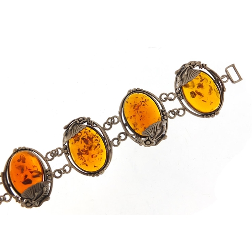 918 - Large naturalistic silver and amber bracelet, 20cm in length, 52.8g