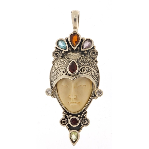 920 - Silver and ivory style face mask pendant set with semi precious stones, 7cm high, 18.8g