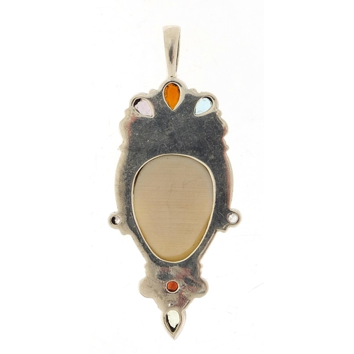 920 - Silver and ivory style face mask pendant set with semi precious stones, 7cm high, 18.8g