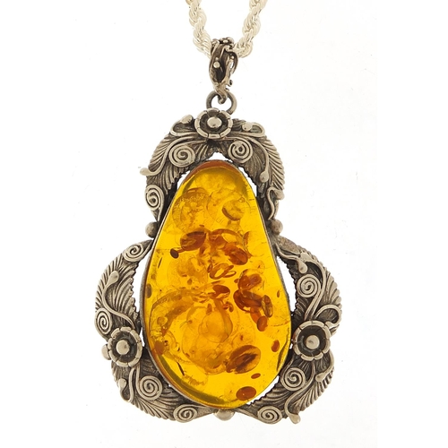 458 - Large naturalistic silver and amber pendant on a silver rope twist necklace, 8cm high and 50cm in le... 