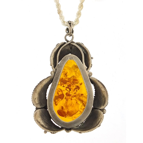 458 - Large naturalistic silver and amber pendant on a silver rope twist necklace, 8cm high and 50cm in le... 