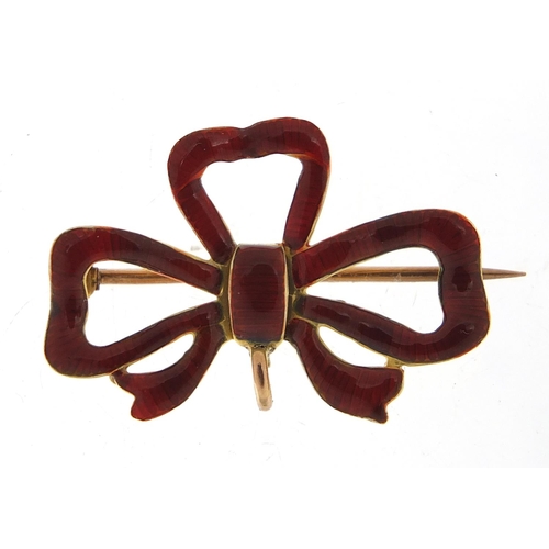 247 - 9ct gold and red enamel bow brooch, 3cm wide, 2.6g