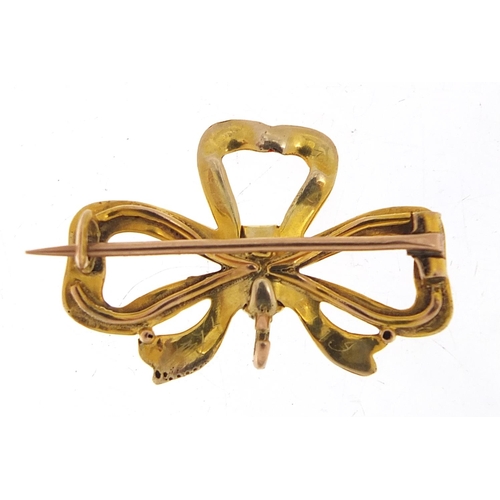 247 - 9ct gold and red enamel bow brooch, 3cm wide, 2.6g