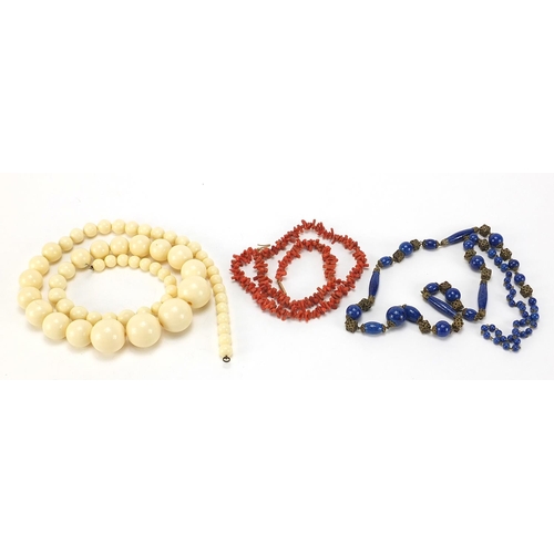 623 - Three vintage necklaces comprising lapis lazuli, coral and faux ivory