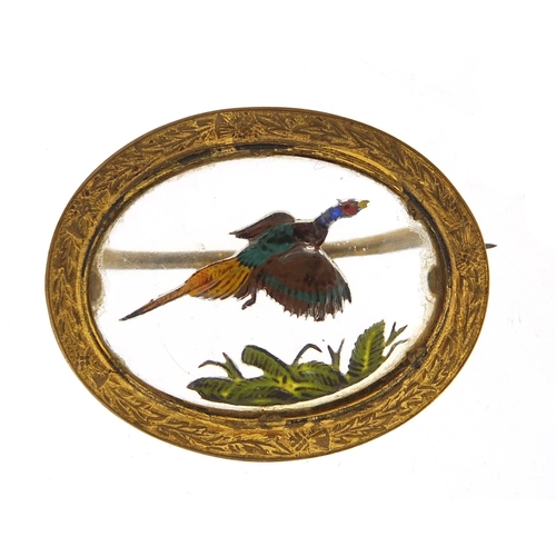 33 - Essex Crystal design brooch depicting a pheasant in flight with gilt metal mount, 4cm wide, 10.5g