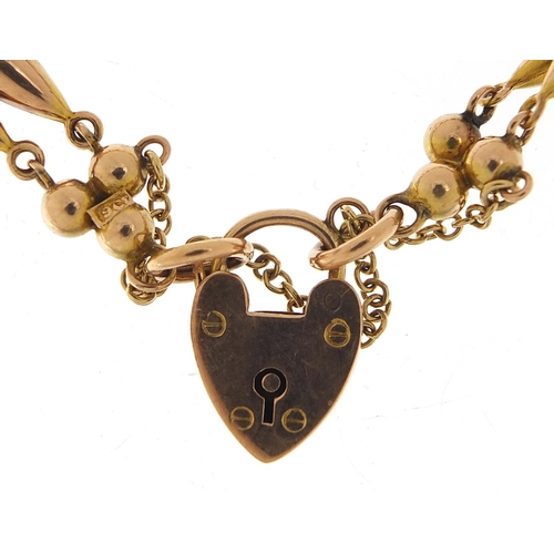 806 - 9ct gold bracelet with love heart padlock, 16cm in length, 8.7g