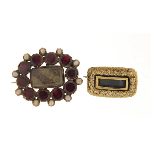 17 - Two Georgian gold coloured metal mourning brooches including one set with garnets and seed pearls, 2... 