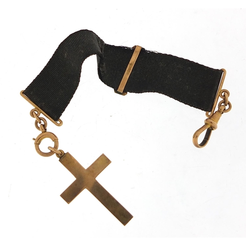 250 - 9ct gold cross pendant on a 9ct gold and silk ribbon with swivel clasp, 17cm in length, the cross 3.... 