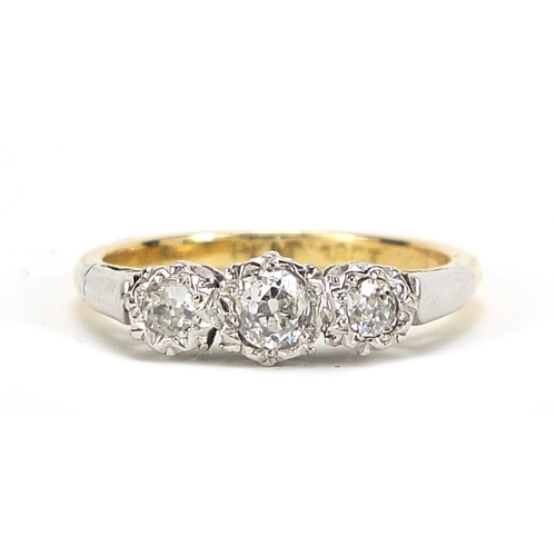 738 - 18ct gold and platinum diamond three stone ring, the centre diamond approximately 3.4mm in diameter,... 