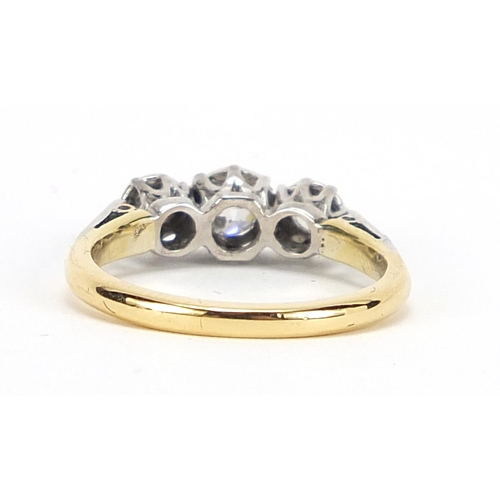 738 - 18ct gold and platinum diamond three stone ring, the centre diamond approximately 3.4mm in diameter,... 